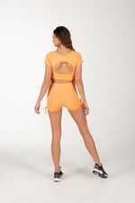 Orange Shorts Set with Cutout Back Design.